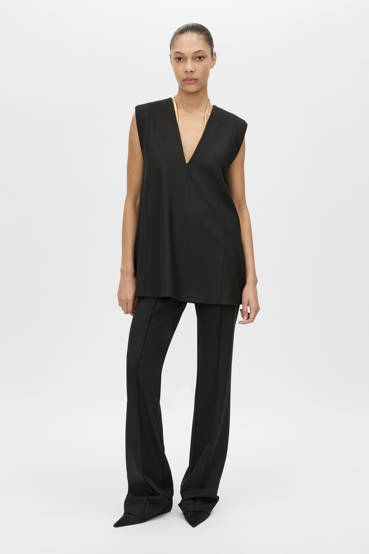 Front view CAMILLA AND MARC Cassie Top in Black with V‑neck sleeveless silhouette and removable snake‑chain detail.