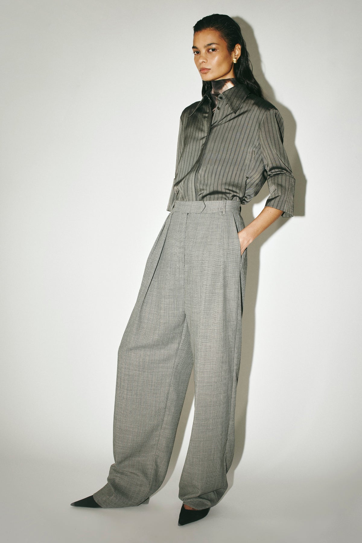 Three-quarter view CAMILLA AND MARC Ren Pant in Charcoal Herringbone styled with the Mina Short Sleeve Shirt.