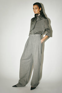 Three-quarter view CAMILLA AND MARC Ren Pant in Charcoal Herringbone styled with the Mina Short Sleeve Shirt.