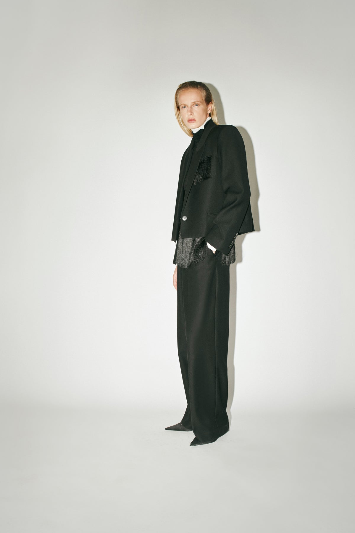 Styled Side View CAMILLA AND MARC Zaman Crop Blazer, single breasted black blazer with fringe detail.