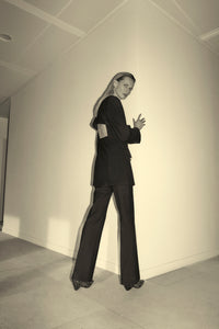 Styled CAMILLA AND MARC Cassie long sleeve mini dress in black with open back removable chain detail.