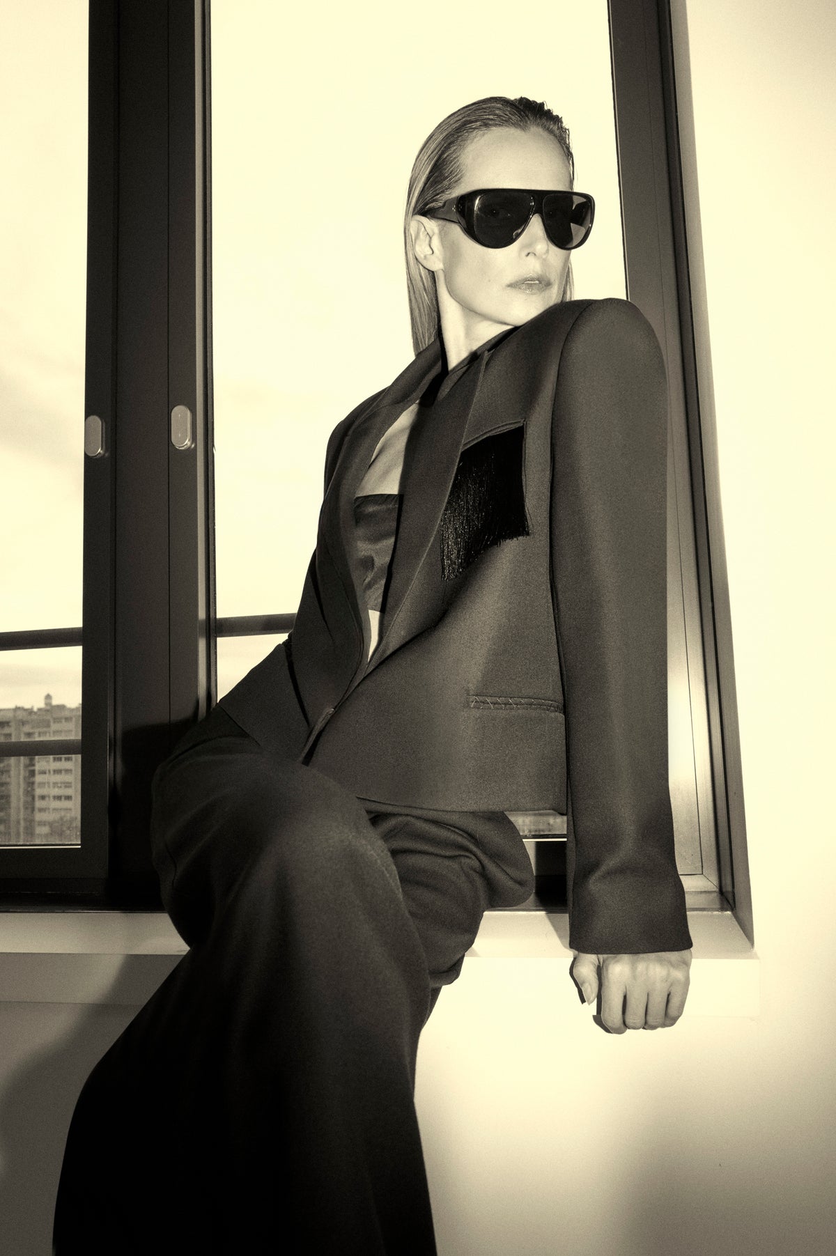 Styled close up view CAMILLA AND MARC Zaman Crop Blazer, single breasted black blazer with fringe detail.