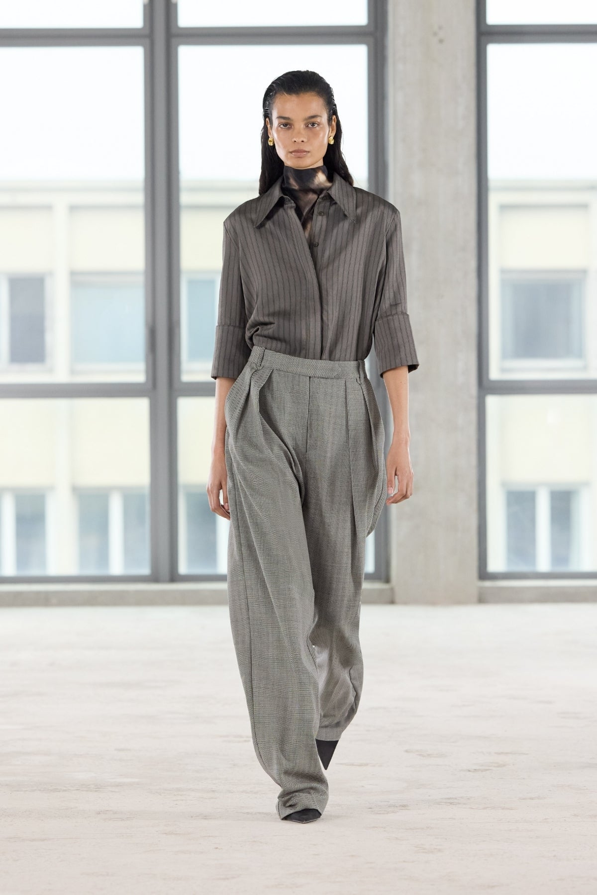 Runway view CAMILLA AND MARC Ren Pant in Charcoal Herringbone with a double‑pleat wide‑leg silhouette.