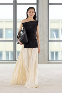 Runway view CAMILLA AND MARC Elise Top in Black with sculpted fit, off‑shoulder design and side hem splits.