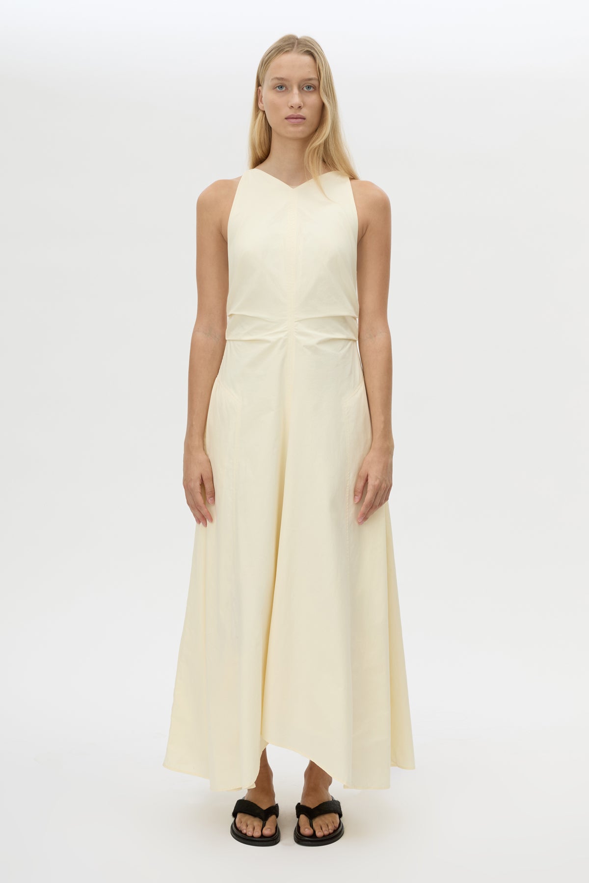 Styled view CAMILLA AND MARC Brera midi dress in pale yellow with topstitch details and side pockets.
