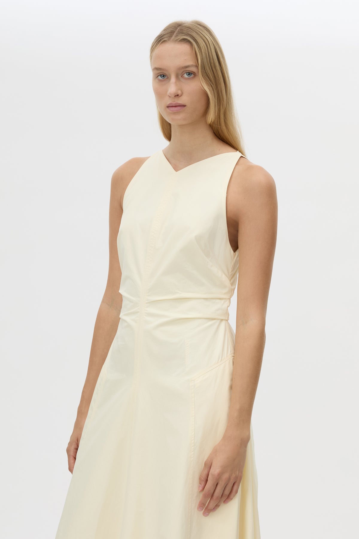 Cropped view CAMILLA AND MARC Brera midi dress in pale yellow with topstitch details and side pockets.