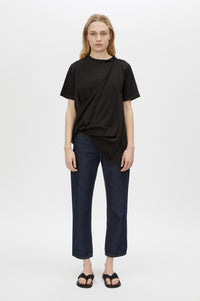 Styled view CAMILLA AND MARC Clarity draped oversized asymmetric tee in black with raw hemline and internal french seams.