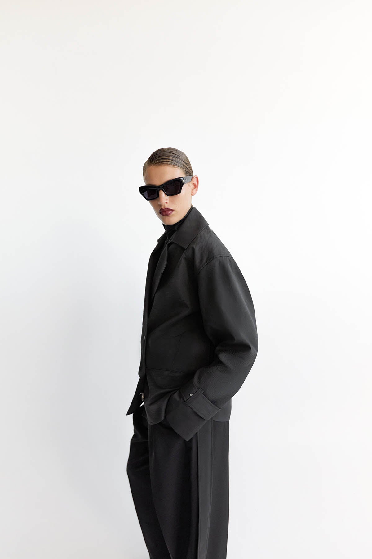 Side View - CAMILLA AND MARC Malia Belted Jacket in black with exaggerated collar and lapel.