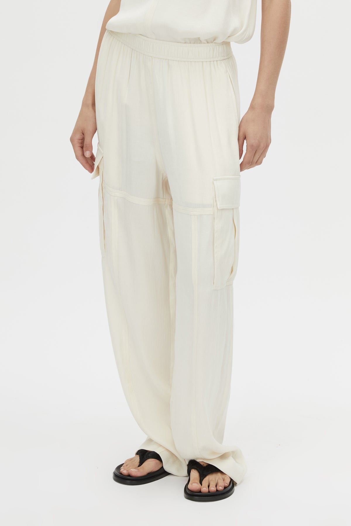 Cropped view CAMILLA AND MARC Allegro Satin Pant in Cream with mid‑rise cargo fit.