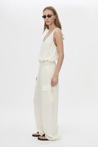 Side view CAMILLA AND MARC Allegro Satin Pant in Cream with mid‑rise cargo fit.