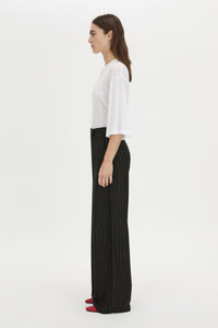Side view CAMILLA AND MARC wide-leg Alvar Relaxed Pant in black and white stripe with a low rise fit.
