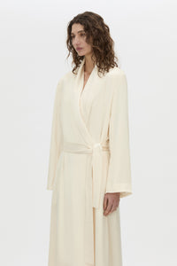 Cropped view CAMILLA AND MARC Arion Shawl Collar Dress in cream with wrapped robe-style design.