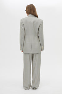 Back view CAMILLA AND MARC Aspira Blazer in Dusty Blue with a draped double‑breasted wool silhouette.