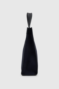 Side view CAMILLA AND MARC August Tote Bag in navy with black trim in cotton-linen canvas.