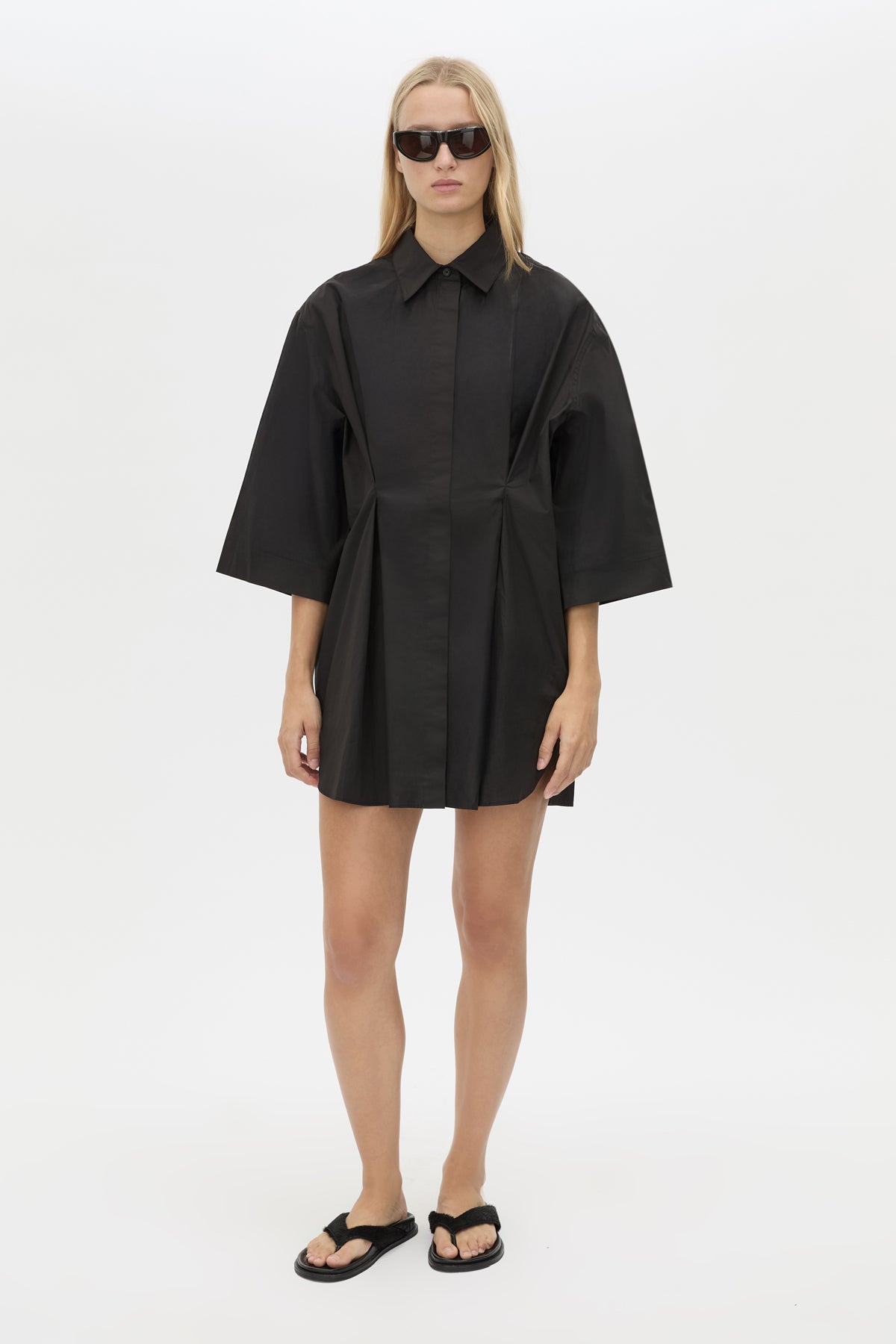 Front View - CAMILLA AND MARC Avant collared black shirt dress with front symmetric pleat details. 