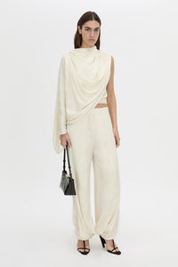 Front-styled view CAMILLA AND MARC Avis Pant in cream with wide-leg balloon design.