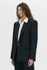 crop view CAMILLA AND MARC Bostan Blazer in a tailored navy fabrication, single-breasted silhouette, sharp shoulder pads, flap welt pockets, chest mock welt pocket, centre back vent and fully lined.