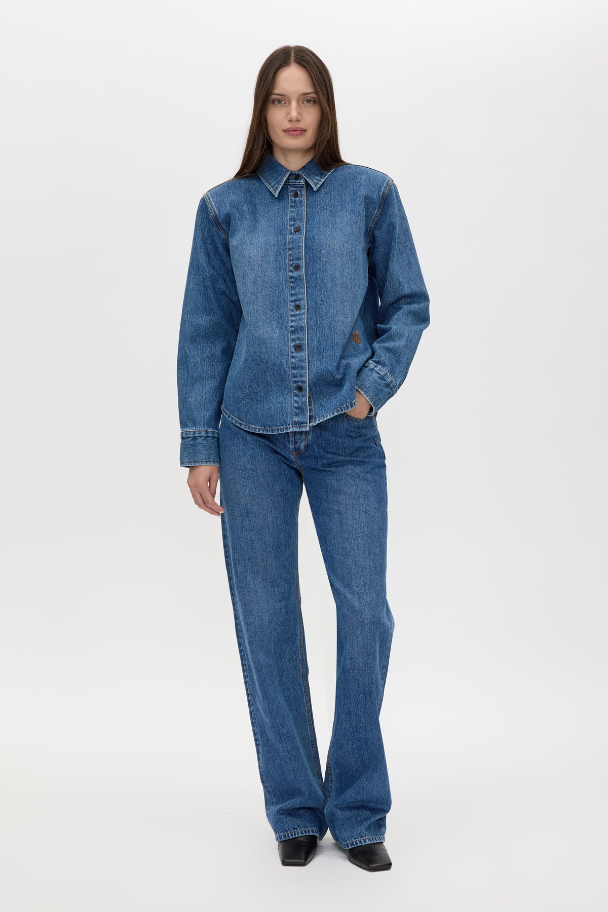 Front view CAMILLA AND MARC Caden Denim Shirt in Dark Classic Blue with shoulder pads and an embroidered monogram.