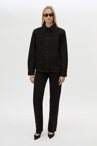 Front view CAMILLA AND MARC Caden Denim Shirt in True Black with shoulder pads and embroidered monogram detailing.