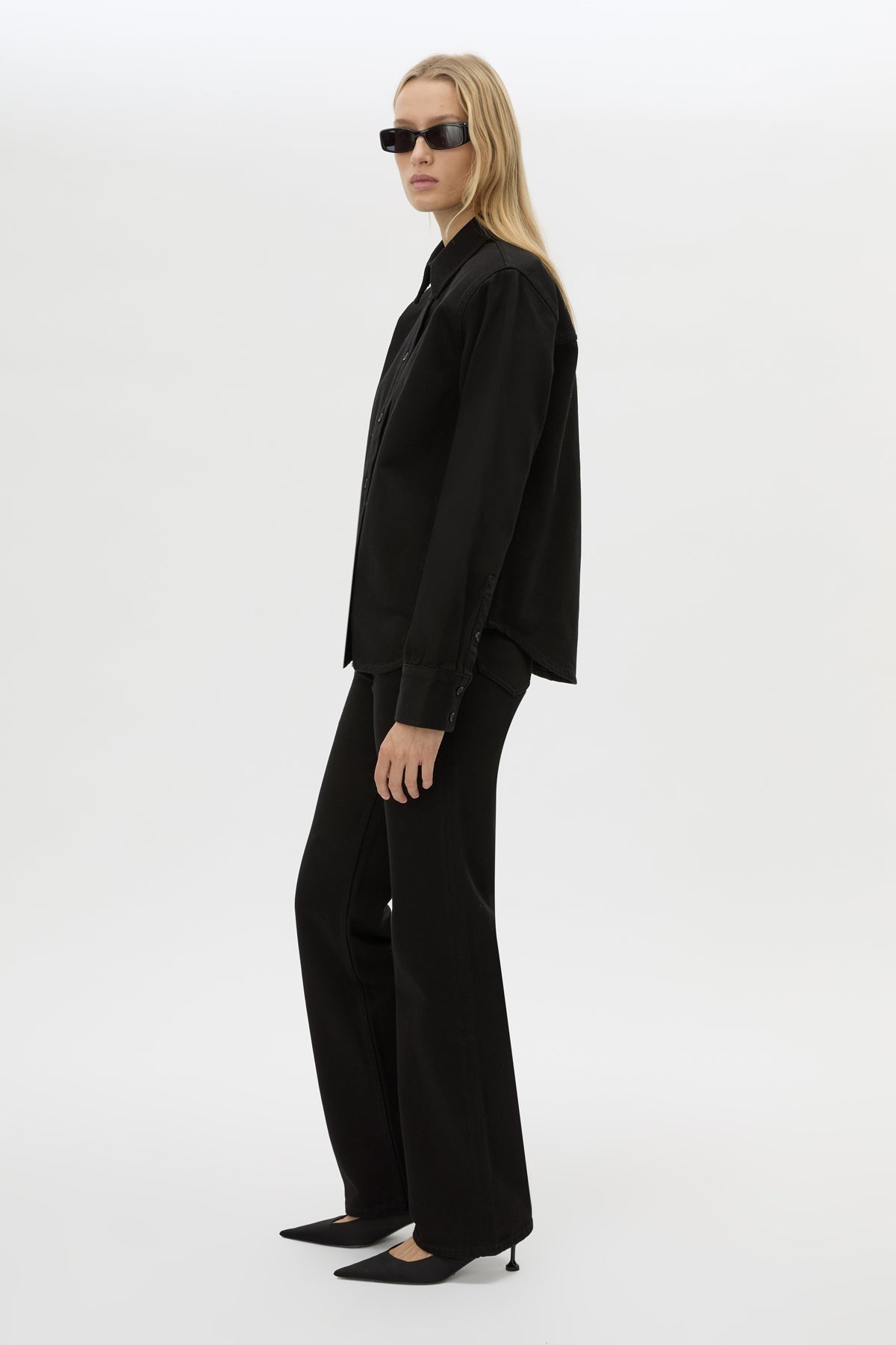 Side view CAMILLA AND MARC Caden Denim Shirt in True Black with shoulder pads and embroidered monogram detailing.
