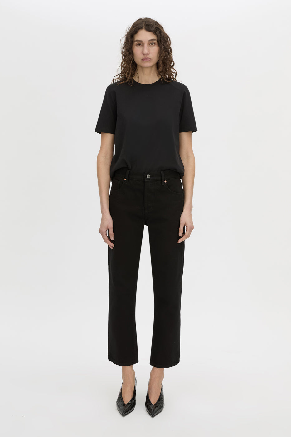 Front styled view CAMILLA AND MARC short sleeve Carmen Shoulder Pad Tee in black with strong shoulder design. 