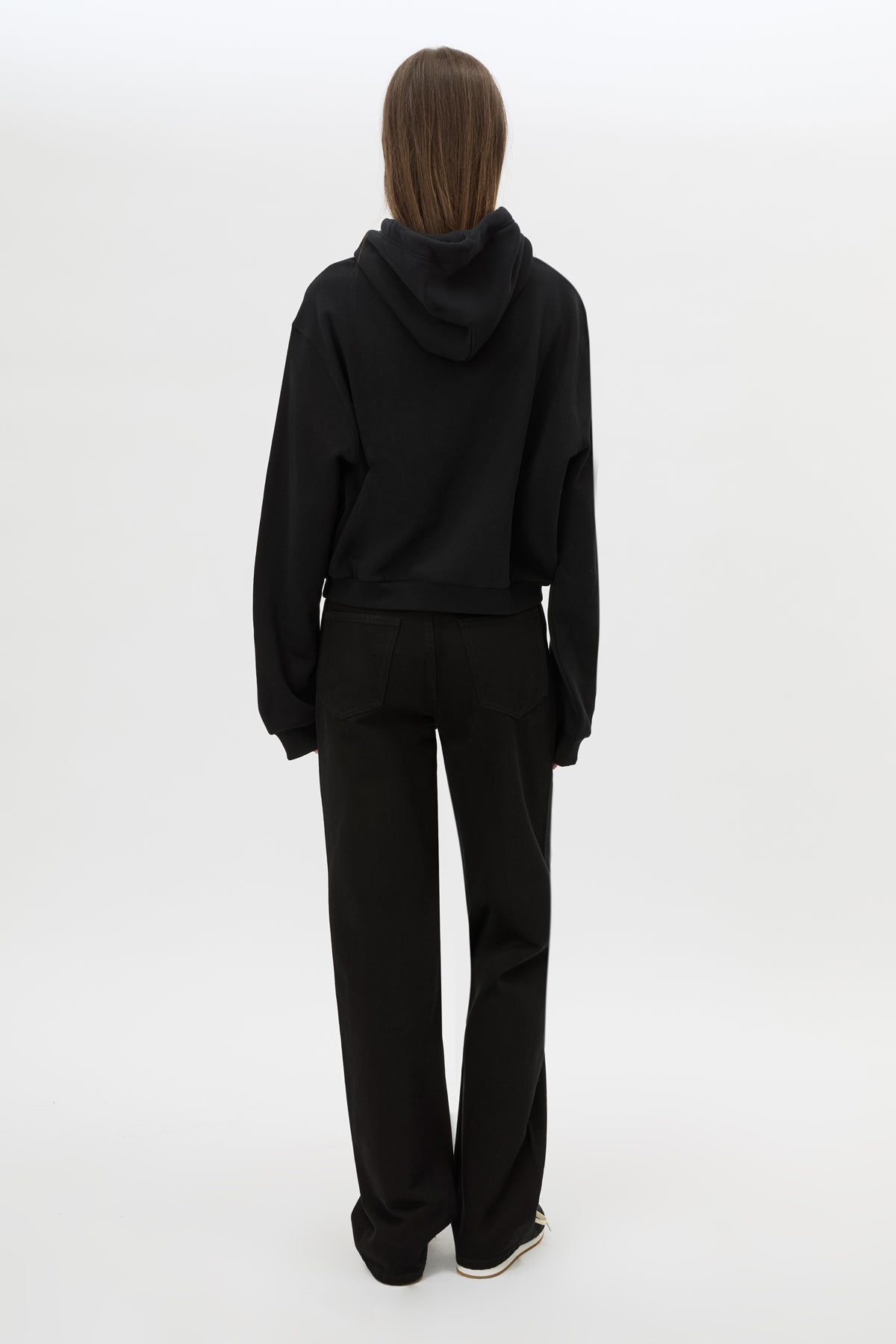 Back view CAMILLA AND MARC Carmont Graphic Hoodie in Black with boxy fit and black graphic logo.