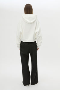 Back view CAMILLA AND MARC Carmont Graphic Hoodie in Soft White with boxy fit and black graphic logo.