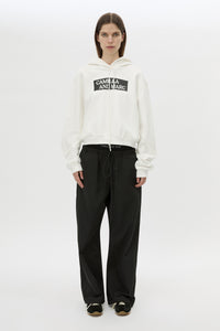 Front view CAMILLA AND MARC Carmont Graphic Hoodie in Soft White with boxy fit and black graphic logo.