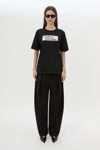 Front styled view CAMILLA AND MARC Carmont Graphic Tee in Black with white graphic logo.