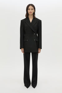 Front styled view CAMILLA AND MARC Cassie long sleeve mini dress in black with open back removable chain detail.