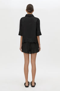 Back view CAMILLA AND MARC Chara Embroidered Cropped Shirt in Black with short sleeves.