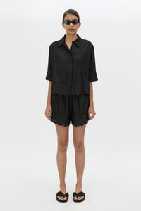 Front styled view CAMILLA AND MARC Chara Embroidered Cropped Shirt in Black with short sleeves.