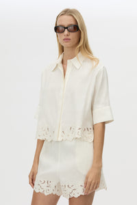 Cropped view CAMILLA AND MARC Chara Embroidered Cropped Shirt in Cream with short sleeves, lace hem and slight A‑line fit.