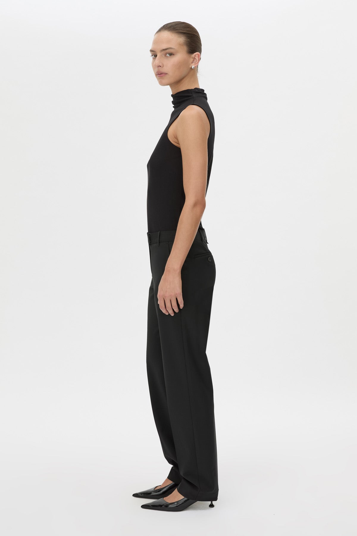 Side view CAMILLA AND MARC Chiaro Slim-Fit Pant in black with low‑waisted, tailored waistband.