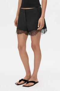 Cropped view CAMILLA AND MARC Chiaro Mini Short in black with lace hem detail.