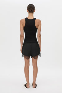 Back view CAMILLA AND MARC Chiaro Mini Short in black with lace hem detail.