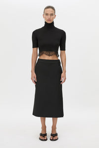 Front view CAMILLA AND MARC Chiaro Midi Skirt in black with low‑rise fit.
