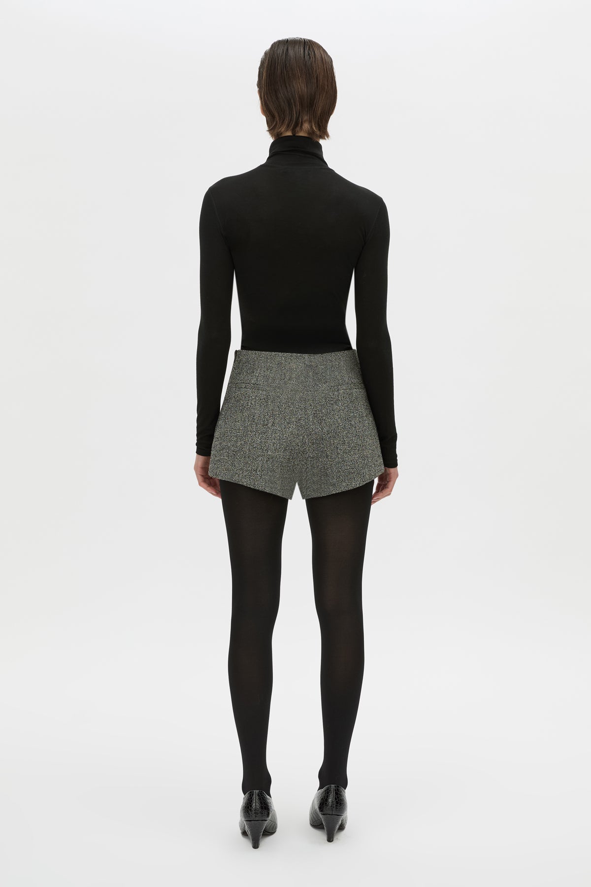 Back view CAMILLA AND MARC high waisted Cinder Mini Short in charcoal grey with invisible side seam closure.