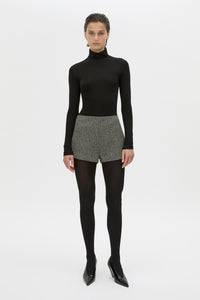 Front styled view CAMILLA AND MARC high waisted Cinder Mini Short in charcoal grey with invisible side seam closure.