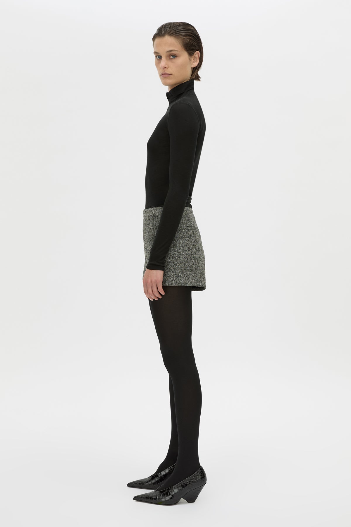 Side view CAMILLA AND MARC high waisted Cinder Mini Short in charcoal grey with invisible side seam closure.