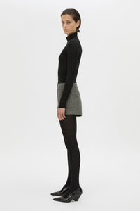 Side view CAMILLA AND MARC high waisted Cinder Mini Short in charcoal grey with invisible side seam closure.