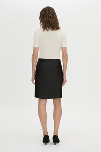 Back view CAMILLA AND MARC Dakota slim fit cream top with ribbed turtle neck.