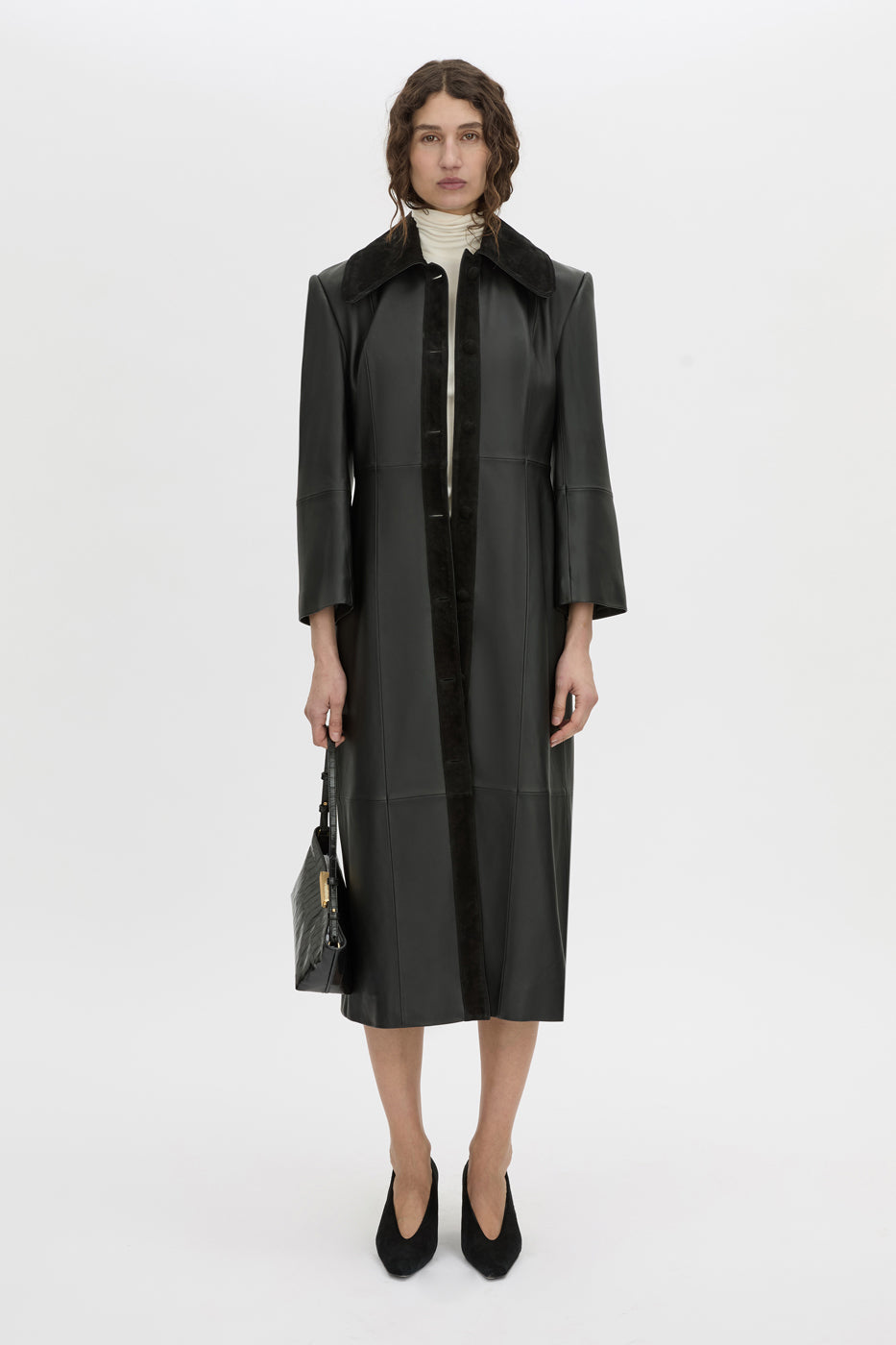 Front-styled-2 view CAMILLA AND MARC Dakota slim fit cream top with ribbed turtle neck.