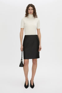 Front-styled view CAMILLA AND MARC Dakota slim fit cream top with ribbed turtle neck.