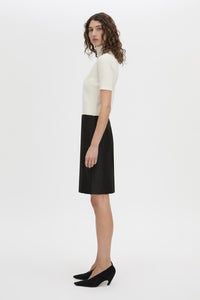 Side view CAMILLA AND MARC Dakota slim fit cream top with ribbed turtle neck.