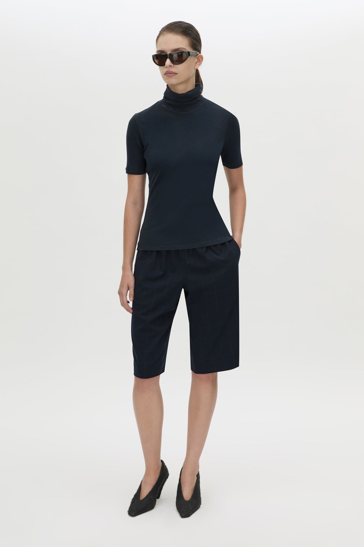 Front-styled view CAMILLA AND MARC Dakota slim fit navy top with ribbed turtle neck.