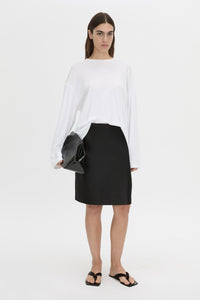 Front-styled view CAMILLA AND MARC Dakota long sleeve top in soft white.