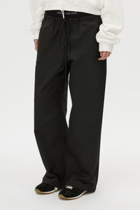Cropped view CAMILLA AND MARC Dia Elastic Detail Pant in Black with logo detail.