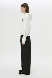 Side view CAMILLA AND MARC Dia Elastic Detail Pant in Black with logo detail.