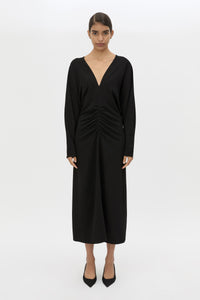 Front styled view CAMILLA AND MARC Dune Draped Waist Midi Dress in Black with gathered waist detailing.